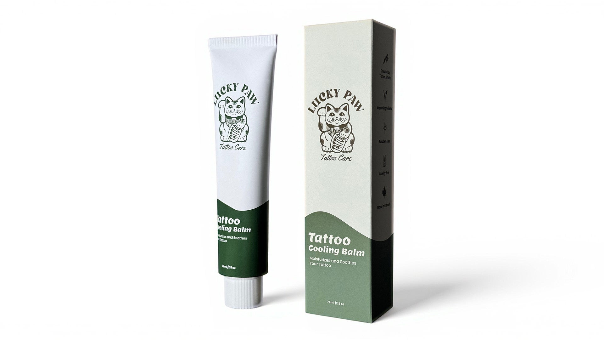 Lucky Paw Tattoo Cooling Balm tube and packaging box standing upright on a white studio background, featuring green and cream design with Lucky Paw logo.