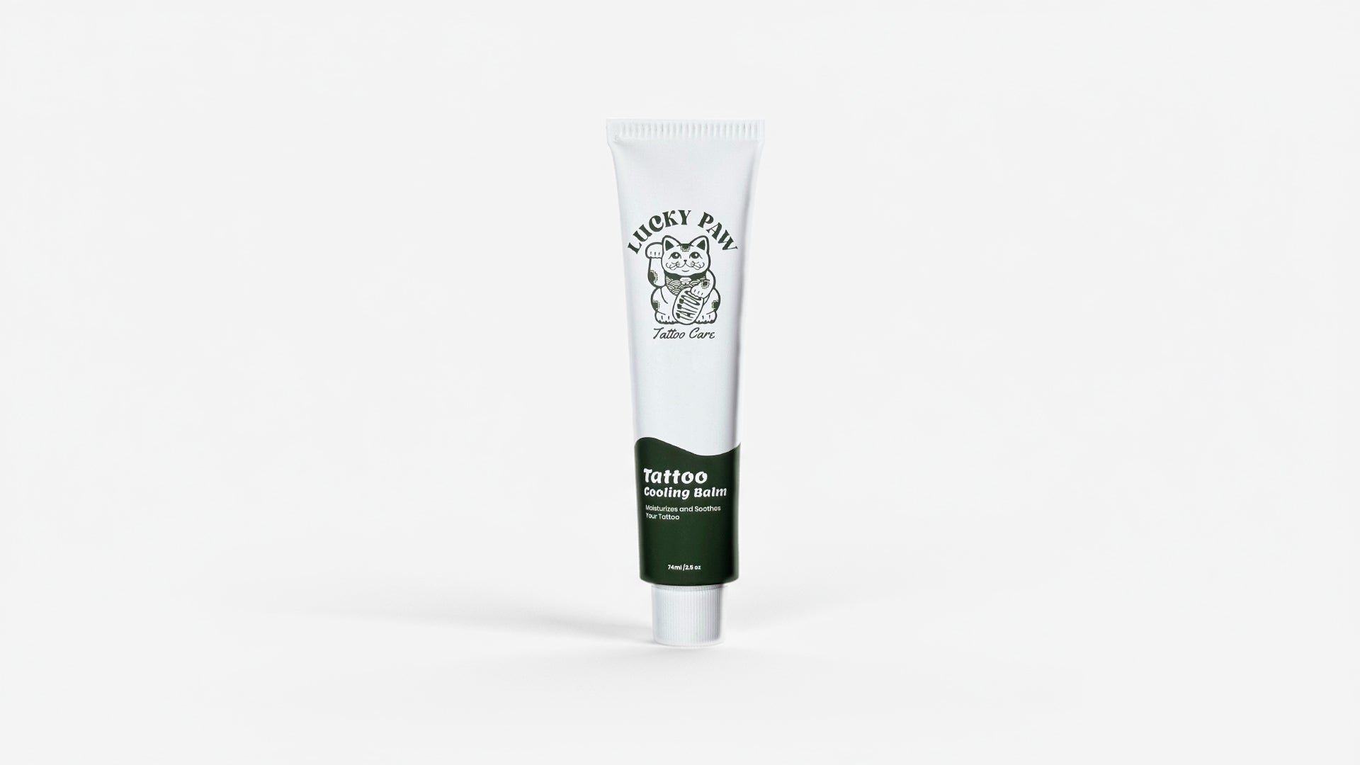 Single tube of Lucky Paw Tattoo Cooling Balm standing upright on a white background, showing the Lucky Paw Tattoo Care logo and green label.