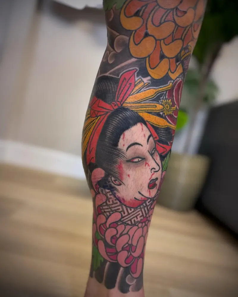 Healed namakubi and chrysanthemum leg tattoo by our artists
